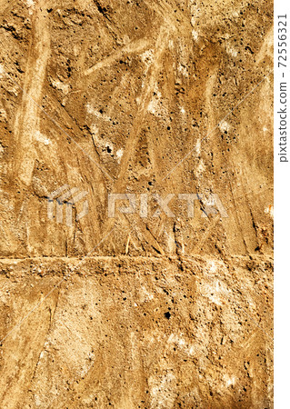 The imprint on a concrete is a texture of wooden plywood orange-yellow color The imprint on a concrete is a texture of wooden plywood orange-yellow color 72556321