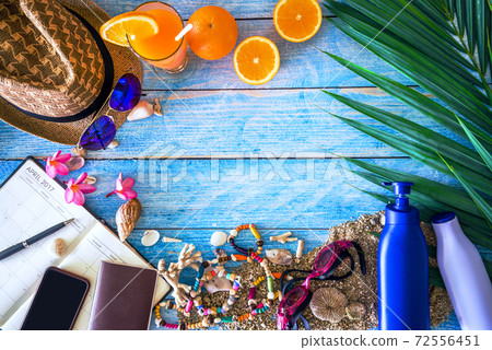 Beach outfit Accessories On bright blue background - Summer Holiday Banner, Beach tourism concept. Summer concept, Travel nature, Travel relax, Beach Summer. 72556451