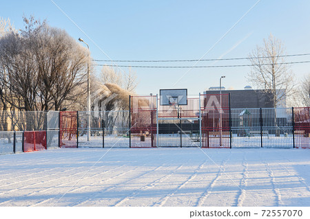 public outdoor basketball court on a frosty winter day public outdoor basketball court on a frosty winter day 72557070