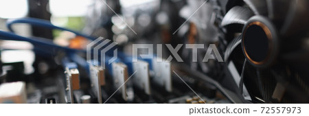 Set of riser installed at pci express slots of cryptocurrency mining farm Set of riser installed at pci express slots of cryptocurrency mining farm 72557973
