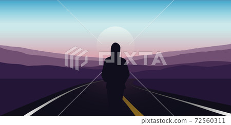 girl stad on the asphalt road and looks to the mountains 72560311