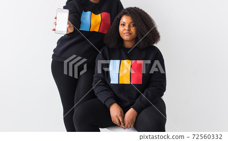 African american woman showing blank phone screen, mockup African american woman showing blank phone screen, mockup 72560332