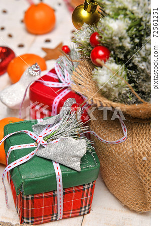 sweet food top view background for merry christmas or new year holiday decoration - chocolate candies, tangerines, cookies, marshmallow and cocoa latte on white wood 72561251