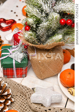 sweet food top view background for merry christmas or new year holiday decoration - chocolate candies, tangerines, cookies on white wood sweet food top view background for merry christmas or new year holiday decoration - chocolate candies, tangerines, cookies on white wood 72561252