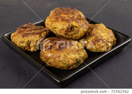 Homemade meat beef burger patties cutlet heap on black plate table background. Keto diet concept 72562562