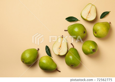 Fresh green pears on beige background, top view 72562775