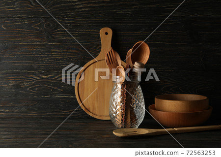 Different wooden kitchenware on wooden background, space for text 72563253