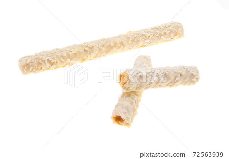 wafer rolls with coconut flakes isolated wafer rolls with coconut flakes isolated 72563939