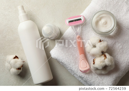 Shaving accessories on white table, top view 72564239