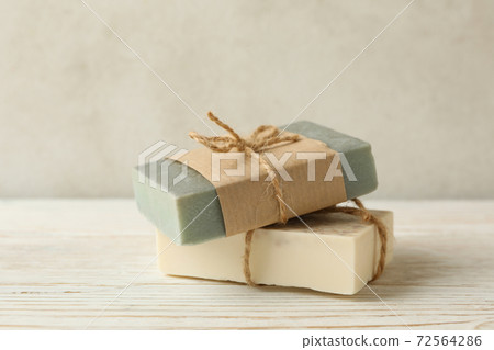 Pieces of natural handmade soap on wooden background Pieces of natural handmade soap on wooden background 72564286