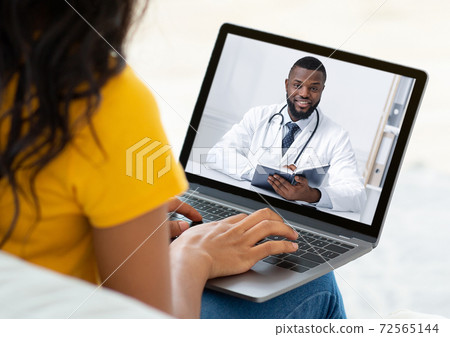 Ehealth. Unrecognizable woman having online video conference with doctor on webcam, using laptop to chat with GP 72565144