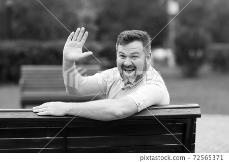 Funny good-natured cheerful middle-aged man with a beard Funny good-natured cheerful middle-aged man with a beard 72565371