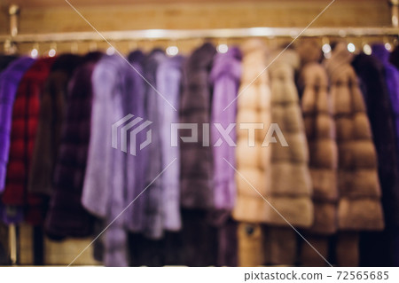 Background Blurred Defocused A row of vintage coats made of animal fur. Background Blurred Defocused A row of vintage coats made of animal fur. 72565685