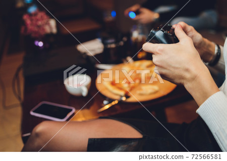 Controller or Videogame Joystick Console in hands. Close up, game concept. Controller or Videogame Joystick Console in hands. Close up, game concept. 72566581