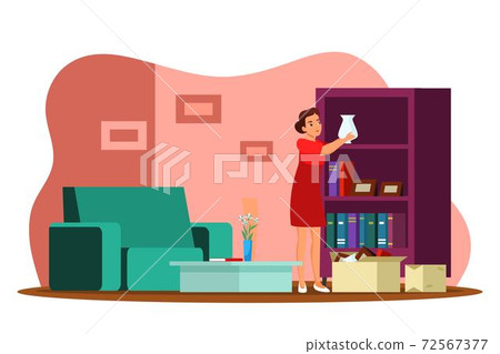 Woman unpacking cardboard box and home moving 72567377