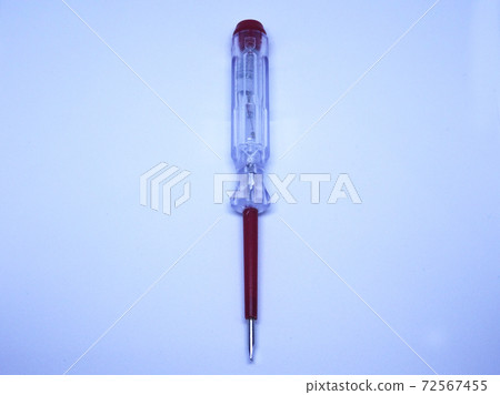 Selective focus of electric test pen screwdriver and voltage detector probe isolated on white background. Selective focus of electric test pen screwdriver and voltage detector probe isolated on white background. 72567455