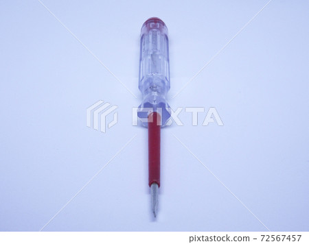 Selective focus of electric test pen screwdriver and voltage detector probe isolated on white background. Selective focus of electric test pen screwdriver and voltage detector probe isolated on white background. 72567457