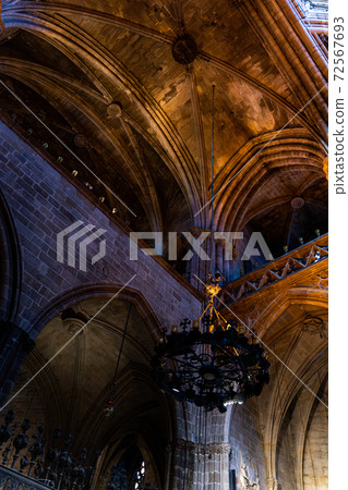 Old medieval spanish catholic church with rooftop in Barcelona 72567693
