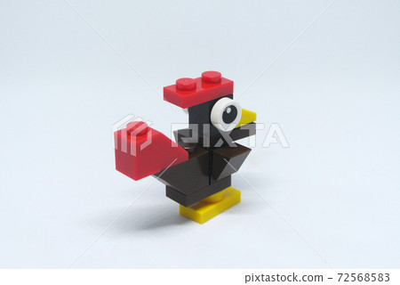Selected focused on the shape of a rooster made of colorful plastic toy blocks and isolated on white background Selected focused on the shape of a rooster made of colorful plastic toy blocks and isolated on white background 72568583