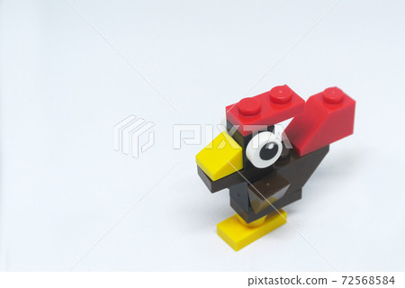 Selected focused on the shape of a rooster made of colorful plastic toy blocks and isolated on white background Selected focused on the shape of a rooster made of colorful plastic toy blocks and isolated on white background 72568584
