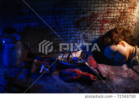 Human limbs and remains are covered in blood. Creepy and gloomy room for medical experiments 72568780