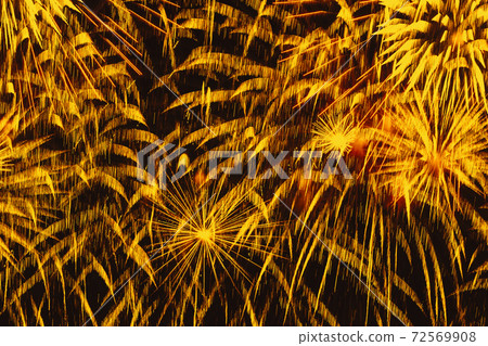 Holiday firework. Colorful golden sparks, glowing rain of comets and twinkling stars. Abstract festive background Holiday firework. Colorful golden sparks, glowing rain of comets and twinkling stars. Abstract festive background 72569908