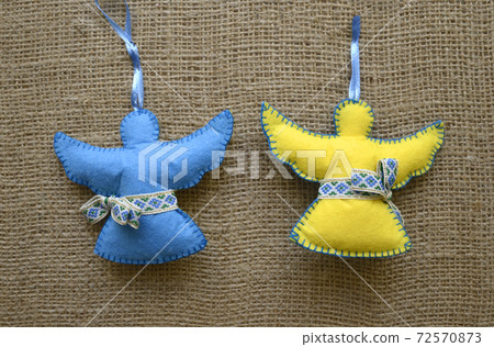 Christmas decoration made of wool, painted in Ukrainian national colors 72570873