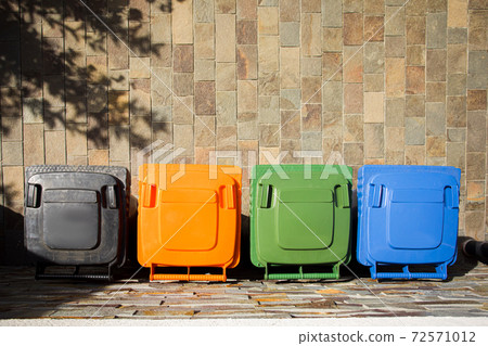 Top view four trash containers on the cement floor Top view four trash containers on the cement floor 72571012