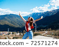 Young woman in Sochi with mountain view on the background, Russia. 72571274