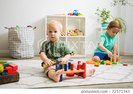 Toddler kid and baby play with educational toys Toddler kid and baby play with educational toys 72571343