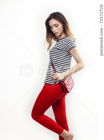 young pretty teenage hipster girl posing emotional happy smiling on white background, lifestyle people concept 72572729