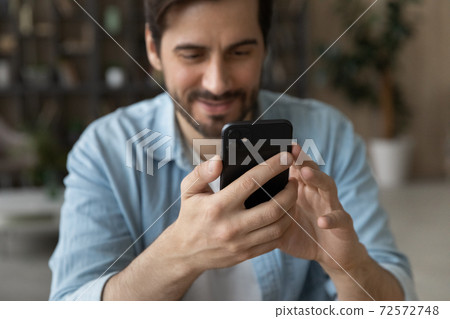 Close up of man using modern smartphone gadget 72572748