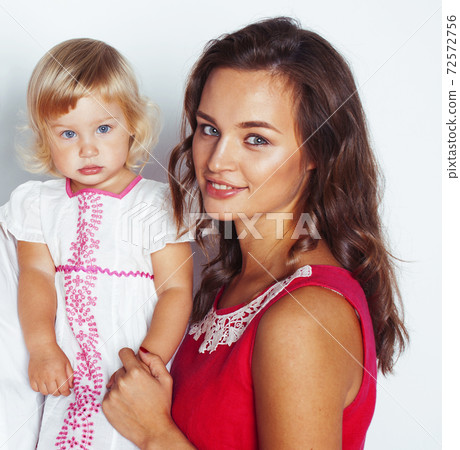young pretty stylish mother with little cute blond daughter hugging, happy smiling real family, lifestyle people concept young pretty stylish mother with little cute blond daughter hugging, happy smiling real family, lifestyle people concept 72572756