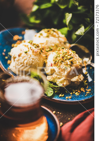 Turkish traditional dessert semolina helva with Turkish traditional dessert semolina helva with 72573376