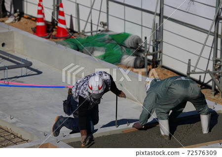 Technical intern trainee working at a construction site 72576309