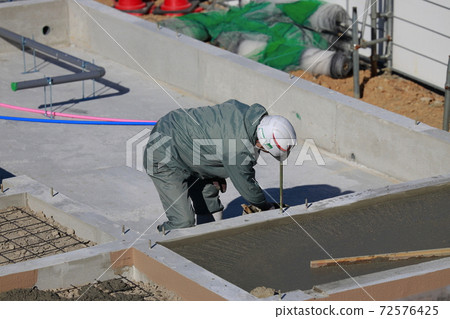 Technical intern trainee working at a construction site Technical intern trainee working at a construction site 72576425