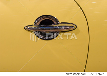 the close up of Car handle with central key lock. 72577674