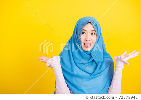Asian Muslim Arab woman Islam wear veil she victories expression raises hands glad excited cheerful Asian Muslim Arab woman Islam wear veil she victories expression raises hands glad excited cheerful 72578945