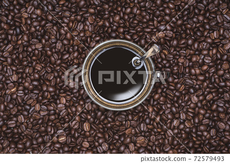 Cup of Black coffee placed, with Roasted Full frame coffee beans background 72579493