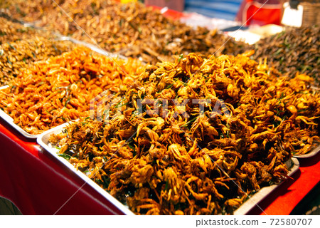 Worms and fried insects Spicy stir-fry at a market in Thailand that is Thai food. And has a lot of natural proteins. 72580707
