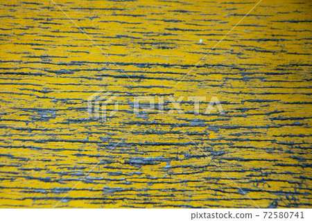 The texture background of the old weathered plank painted in yellow. 72580741