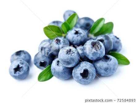 Blueberries with leaves on white backgrounds. Blueberries with leaves on white backgrounds. 72584893