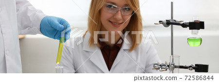 Technician hold in arms in protective gloves 72586844