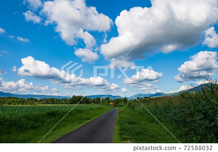 A landscape of blue sky and white clouds in a clear summer sky 72588032
