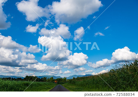 A landscape of blue sky and white clouds in a clear summer sky 72588034