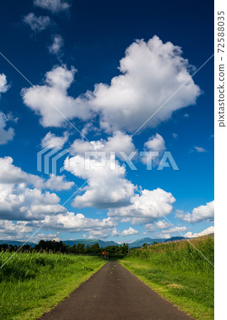 A landscape of blue sky and white clouds in a clear summer sky 72588035