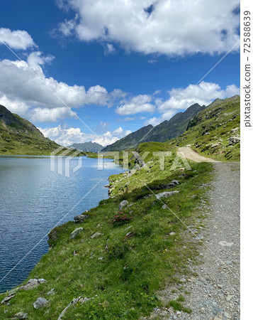 Footpath on the shore of the Lake Giglachsee in the Styrian Tauern - Austria. 72588639