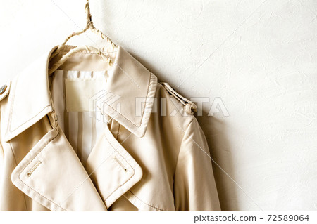Upper body of light beige trench coat-around shoulders and chest Upper body of light beige trench coat-around shoulders and chest 72589064