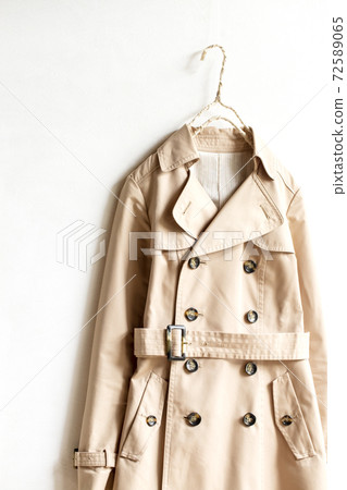 Light beige trench coat and white background Light beige trench coat and white background 72589065