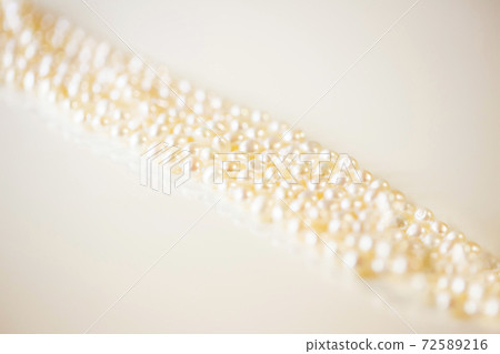 Pearl necklace up and white background and copy space Pearl necklace up and white background and copy space 72589216